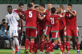 FS213 - Agadir, -, MOROCCO : Morocco's team celebrate after scoring a goal during the World Cup 2018 qualifier football match between Morocco and Equatorial Guinea on November 12, 2015 in Agadir. AFP PHOTO / FADEL SENNA