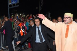 A photo made available 07 November 2015 of Morocco's King Mohammed VI (R) waving to the crowd during a rally marking the 40th anniversary of the 'Green March' in Laayoune, West Sahara, late 06 November 2015. Western Sahara, a former Spanish colony, is at the center of a conflict since 1975 between Morocco and the Polisario Front, which is backed by Algeria.