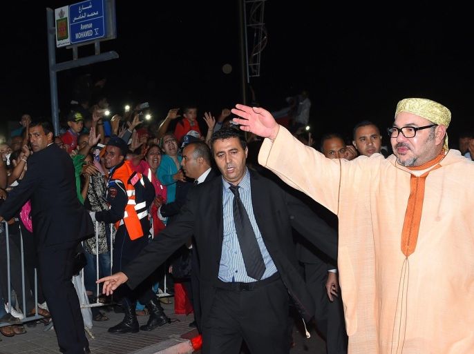 A photo made available 07 November 2015 of Morocco's King Mohammed VI (R) waving to the crowd during a rally marking the 40th anniversary of the 'Green March' in Laayoune, West Sahara, late 06 November 2015. Western Sahara, a former Spanish colony, is at the center of a conflict since 1975 between Morocco and the Polisario Front, which is backed by Algeria.