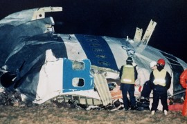 FILE - In this Dec. 21, 1988, file photo, rescue workers examine the nose of Pan Am Flight 103 near the town of Lockerbie, Scotland, after a bomb aboard exploded, killing a total of 270 people. Families of some of the 270 people who died in the airliner bombing 25 years ago gathered for memorial services Saturday, Dec. 21, 2013, in the United States and Britain, honoring victims of the terror attack that killed dozens of American college students and created instant havoc in the Scottish town where wreckage of the plane rained down. (AP Photo/Martin Cleaver, File)