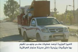 كاميرا الجزيرة ترصد عمليات سلـب ونهـب تقوم بها مليشيات يزيدية داخل مدينة سنجار العراقية