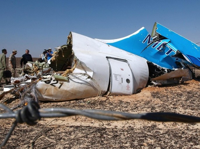 A handout picture provided by the Russian Emergency Ministry press service on 02 November 2015 shows Russian Emergency Situations Minister Vladimir Puchkov (4-L) and unidentified officials near a piece of wreckage of Russian MetroJet Airbus A321 at the site of the crash in Sinai, Egypt, 01 November 2015. The A321 plane of Metrojet en route from Sharm-el-Sheikh, to St. Petersburg crashed in the Sinai, Egypt on 31 October 2015, killing all 224 people on board. EPA/MAXIM GRIGORIEV / RUSSIAN EMERGENCY MINISTRY / HANDOUT HANDOUT EDITORIAL USE ONLY/NO SALES
