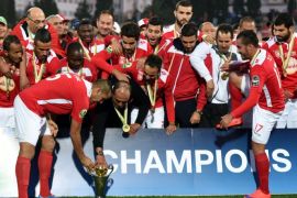 1061 - Sousse, -, TUNISIA : Etoile du Sahel players pose with the CAF trophy after defeating the Orlando Pirates during the second final of the 2015 CAF - Confederation of African Football Cup match between Tunisia's Etoile du Sahel and South Africa's Orlando Pirates at the Sousse Olympic stadium. Sahel defeated the Pirates 1-0 in the second leg and 2-1 on aggregate to lift the 2015 CAF trophy. AFP PHOTO / FETHI BELAID
