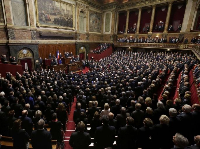 French President Francois Hollande, French deputies and senators sing "La Marseillaise", the French national anthem, at a special congress of the joint upper and lower houses of parliament (National Assembly and Senate) at the Palace of Versailles, near Paris, France, November 16, 2015, following the series of deadly attacks on Friday in the French capital. French President Francois Hollande said on Monday France was at war against cowards, and not in a clash of civilisations, after militant attacks killed at least 129 people in and around Paris last week. REUTERS/Philippe Wojazer
