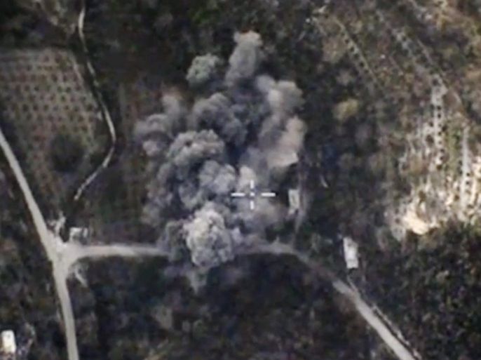 A handout frame grab from a video footage made available on the official website of the Russian Defence Ministry on 26 October 2015 shows an aerial view of smoke rising after airsrike carried out by a Russian warplane against what Russian Defence Minitry says a terrorist militant group position in Latakia province in Syria. Russia in September began a bombing campaign against militant groups in Syria to support al-Assad's government, one of Russia's closest allies in the Middle East. EPA/RUSSIAN DEFENCE MINISTRY/HANDOUT