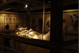 Visitors look at a replica of the coffin of the Egyptian pharaoh Tutankhamun at the King Tutankhamun Exhibition in the Reina Torre de Arauz museum in Panama City October 11, 2012. The exhibition, which displays replicas of treasures of King Tutankhamun and other ancient Egyptian pharaohs, will run from October 9 to the end of November.