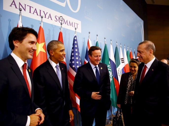 Turkey's President Tayyip Erdogan (R) chats with Canada's Prime Minister Justin Trudeau (L), U.S. President Barack Obama (2nd L) and British Prime Minister David Cameron (3rd L) before a working dinner at the Group of 20 (G20) summit in the Mediterranean resort city of Antalya, Turkey, November 15, 2015. REUTERS/Kayhan Ozer/Pool