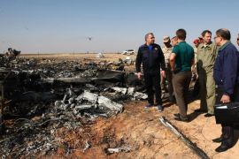 A handout picture provided by the Russian Emergency Ministry press service on 02 November 2015 shows Russian Emergency Situations Minister Vladimir Puchkov (L) and unidentified officials at the site of crash of Russian MetroJet Airbus A321 in Sinai, Egypt, 01 November 2015. The A321 plane of Metrojet en route from Sharm-el-Sheikh, to St. Petersburg crashed in the Sinai, Egypt on 31 October 2015, killing all 224 people on board.