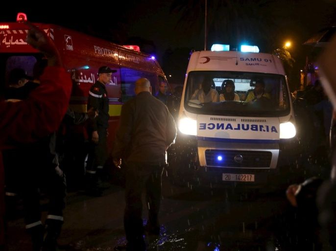 Police help to make way for an ambulance carrying bodies after an attack on a military bus in Tunis, Tunisia November 24, 2015. At least 11 people were killed on Tuesday after an explosion hit a bus carrying Tunisian presidential guards along a major street in the centre of the capital Tunis. Security and presidential sources said the explosion was an attack, adding it was not immediately clear whether it was a bomb or an explosive fired at the bus as it travelled along Mohamed V Avenue. REUTERS/Zoubeir Souissi