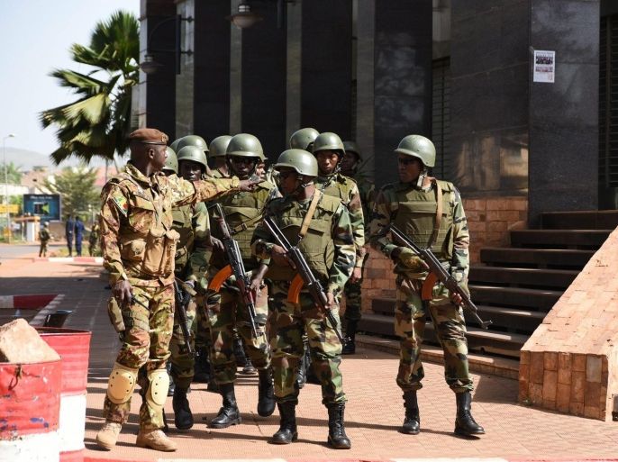 Malian soldiers stand guard outside the Radisson Hotel following a hostage situation a day earlier, in Bamako, Mali 21 November 2015. A state of emergency has been imposed for ten days in Mali following the hostage suitation at the Radisson Hotel in the capital Bamako. At least 27 people were dead on 20 November after Malian special forces stormed the hotel that had been seized by suspected Islamist militants.