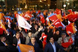 People wave flags outside the AK Party headquarters in Ankara, Turkey November 1, 2015. Turks went to the polls in a snap parliamentary election on Sunday under the shadow of mounting internal bloodshed and economic worries, a vote that could determine the trajectory of the polarised country and of President Tayyip Erdogan. The vote is the second in five months, after the AK Party founded by Erdogan lost in June the single-party governing majority it has enjoyed since first coming to power in 2002. REUTERS/Umit Bektas