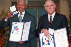 FILE - In this Dec. 10, 1993 file photo, South African Deputy President F.W. de Klerk, right, and South African President Nelson Mandela pose with their Nobel Peace Prize Gold Medals and Diplomas in Oslo. The Nobel Committee praised the pair "for their work for the peaceful termination of the apartheid regime, and for laying the foundations for a new democratic South Africa." (AP Photo/FILE)