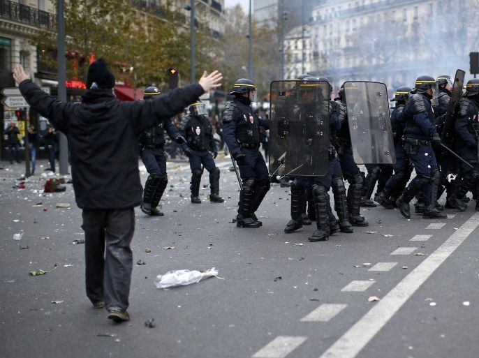 An environmentalist reacts during clashes with French CRS riot police at the Place de la Republique after the cancellation of a planned climate march following shootings in the French capital, ahead of the World Climate Change Conference 2015 (COP21), in Paris, France, November 29, 2015. REUTERS/Benoit Tessier