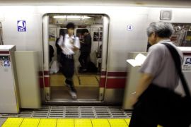 A passenger walks out from a train thought the half-height platform screen doors at a subway station platform in Tokyo Thursday, Sept. 10, 2015. Japan launched suicide prevention week on Thursday, part of a global World Health Organization effort marking Sept. 10 as World Suicide Prevention Day. (AP Photo/Eugene Hoshiko)