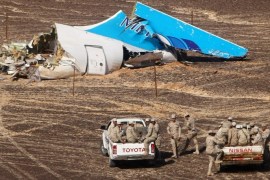 A handout picture provided by the Russian Emergency Ministry press service on 02 November 2015 shows Egyptian servicemen approaching a piece of wreckage of Russian MetroJet Airbus A321 at the site of the crash in Sinai, Egypt, 01 November 2015. The A321 plane of Metrojet en route from Sharm-el-Sheikh, to St. Petersburg crashed in the Sinai, Egypt on 31 October 2015, killing all 224 people on board.