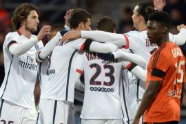 JSE064 - Lorient, Morbihan, FRANCE : Paris Saint-Germain's players celebrate after a goal during the French L1 football match between Lorient and Paris Saint-Germain on November 21, 2015 at the Moustoir stadium in Lorient, western France. AFP PHOTO / JEAN