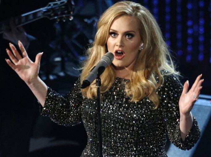 British singer Adele performs the song 'Skyfall' at the 85th Academy Awards in Hollywood, California, in this file photo taken February 24, 2013. Adele, whose latest album '25' has smashed sales records in its first week of release, announced on Thursday she would begin a 15-week concert tour of Britain, Ireland and continental Europe in February, 2016. REUTERS/Mario Anzuoni/Files