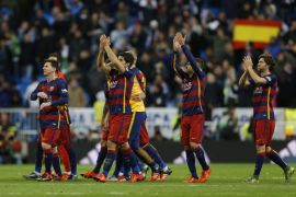 Barcelona's players celebrate their victory at the end of the first clasico of the season between Real Madrid and Barcelona at the Santiago Bernabeu stadium in Madrid, Spain, Saturday, Nov. 21, 2015. (AP Photo/Francisco Seco)
