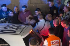 Israeli police arrest a Palestinian identified as Raed Khalil bin Mahmoud, a 36-year-old from the West Bank village of Dura in Tel Aviv, Israel, Thursday, Nov. 19, 2015. Bin Mahmoud fatally stabbed two Israeli men in a Tel Aviv office building on Thursday before being apprehended, police said. (AP Photo/Moti Milrod) ISRAEL OUT