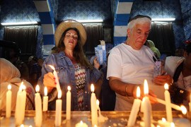 epa04735632 Jewish visitors light candles at the ancient Ghriba Synagogue on the island of Djerba south of Tunis, Tunisia, 06 May 2015. Amid heightened security following attacks in Tunisia, some Jews have made the annual Ghriba pilgrimage celebrating the end of Passover, to the historic synagogue, said to have been built by Jews fleeing the destruction of the temple of Solomon in 586 BC, to Tunisia, which is now home to one of the last Jewish communities in the Middle East and North Africa, save for Israel, though it is now a fraction of the 100'000 at the time of independence from France in 1956. EPA/MOHAMED MESSARA