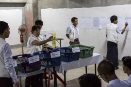 Votes are counted in an unfinished building being used as a polling station in Yangon, Myanmar, Sunday, Nov. 8, 2015. With tremendous excitement and hope, millions of citizens voted Sunday in Myanmar's historic general election that will test whether the military's long-standing grip on power can be loosened, with opposition leader Aung San Suu Kyi's party expected to secure an easy victory. (AP Photo/Amanda Mustard)