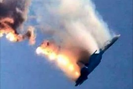 An image grab made from a video shows a burning Russian fighter jet coming down after being shot down near the Turkish-Syrian border, in Hatay on November 24, 2015. NATO member Turkey shot down a Russian fighter jet on the Syrian border today, threatening a major spike in tensions between two key protagonists in the four-year Syria civil war. AFP PHOTO / IHLAS NEWS AGENCY ***TURKEY OUT***