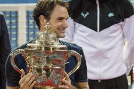 Switzerland's Roger Federer (L) smiles after winning his final match against Spain's Rafael Nadal (R) at the Swiss Indoors tennis tournament at the St. Jakobshalle in Basel, Switzerland, 01 November 2015.
