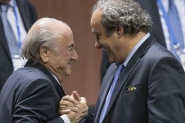 FILE - In this Friday, May 29, 2015 file photo, FIFA president Sepp Blatter after his election as President, left, is greeted by UEFA President Michel Platini, right, at the Hallenstadion in Zurich, Switzerland. FIFA's ethics committee has asked for sanctions against Sepp Blatter and Michel Platini after finishing investigations into their alleged financial wrongdoing. FIFA President Blatter and UEFA President Platini now face bans of several years at full hearings before FIFA ethics judge Joachim Eckert, likely in December. (Patrick B. Kraemer/Keystone via AP, File)