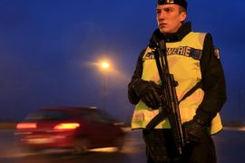 An armed French gendarme stands along the highway as gendarmes check vehicles and verify the identity of travellers on the A2 motorway between Paris-Brussels at the Thun-L'eveque toll station, in France, November 19, 2015, as security increases after last Friday's deadly attacks in the French capital. REUTERS/Pascal Rossignol