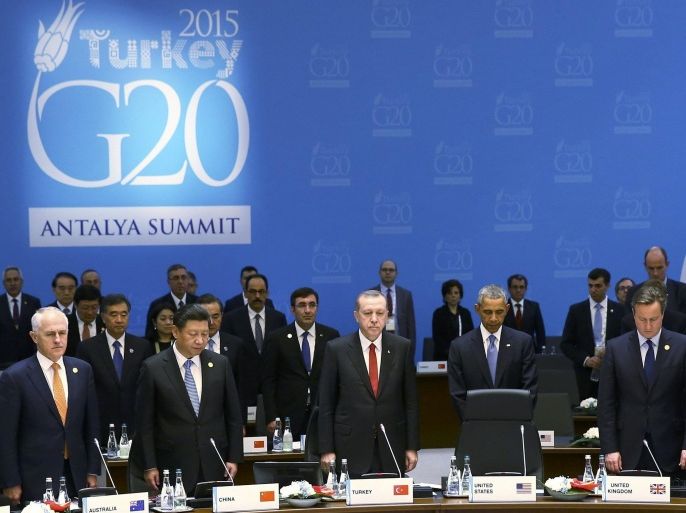 Leaders of the Group of 20 major economies observe a minutes silence in memory of the Paris attacks before a working session at the G20 summit in the Mediterranean resort city of Antalya, Turkey, November 15, 2015. Pictured from L : Brazil's President Dilma Rousseff, Australia's Prime Minister Malcolm Turnbull, China's President Xi Jinping, Turkey's President Tayyip Erdogan, U.S. President Barack Obama, Britain's Prime Minister David Cameron and South Africa's President Jacob Zuma. REUTERS/Kayhan Ozer/Pool TPX IMAGES OF THE DAY