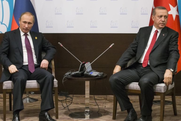 FILE - In this file photo taken on Monday, Nov. 16, 2015, Russian President Vladimir Putin, left, and Turkish President Recep Tayyip Erdogan pose for the media before their talks during the G-20 Summit in Antalya, Turkey. Putin ordered the deployment of long-range air defense missiles to a Russian military base in Syria and Russia‘s military said it would destroy any target that may threaten its warplanes following the downing of a Russian military jet by Turkey. (AP Photo/Alexander Zemlianichenko, file)