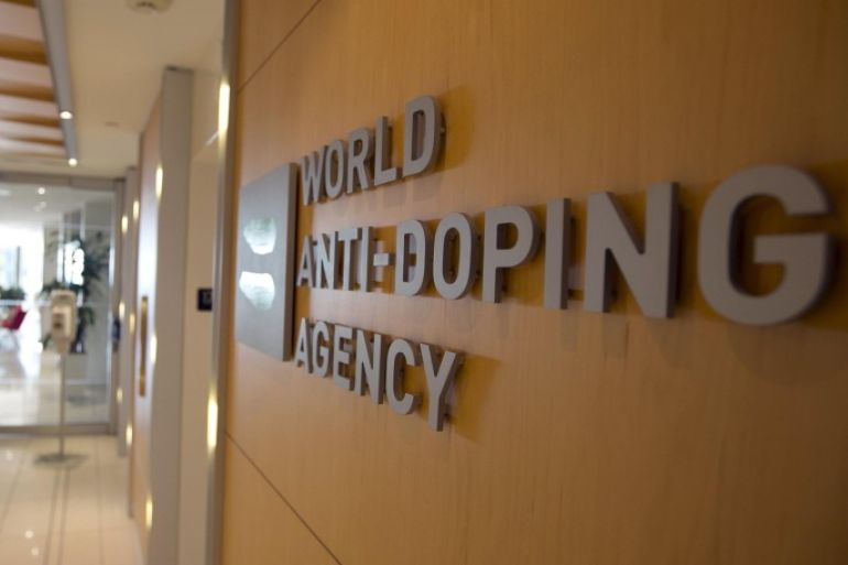 A woman walks into the head office for the World Anti-Doping Agency (WADA) in Montreal, November 9, 2015. An international anti-doping commission recommended on Monday that Russia's Athletics Federation be banned from international competition over widespread doping offences - a move that could see the powerhouse Russian team excluded from next year's Rio Olympics. Russian sports minister said there was no evidence for the accusations against the Federation. REUTERS/Christinne Muschi