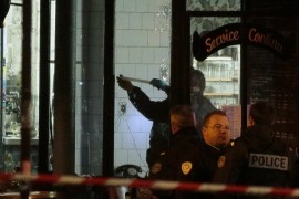 GBA193 - Paris, Paris, FRANCE : Forensic police search for evidences inside the La Belle Equipe cafe, rue de Charonne, at the site of an attack on November 14, 2015 in Paris, after a series of gun attacks occurred across the city. More than 100 people were killed in a mass hostage-taking at a Paris concert hall and many more were feared dead in a series of bombings and shootings, as France declared a national state of emergency. AFP PHOTO / JACQUES DEMARTHON