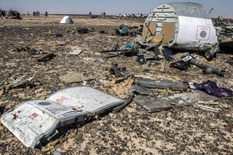 Debris belonging to the A321 Russian airliner areseen at the site of the crash in Wadi el-Zolmat, a mountainous area in Egypt's Sinai Peninsula on November 1, 2015. International investigators began probing why a Russian airliner carrying 224 people crashed in Egypt's Sinai Peninsula, killing everyone on board, as rescue workers widened their search for missing victims. AFP PHOTO / KHALED DESOUKI