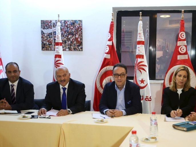 Hafhed Caid Essebsi (C), son of Tunisian president Beji Caid Essebsi, meets with Nidaa Tounes party leaders in Tunis, Tunisia November 3, 2015. Tensions between two wings of Nidaa Tounes, whose name means Call of Tunis, spilled over into violence last week when a party meeting descended into open fighting with fists and sticks. A split within Nidaa Tounes could trigger political instability in the country that launched the first of the Arab Spring revolutions in 2011. Thirty-two of Nidaa Tounes' 86 lawmakers have already threatened to break away in protest at what they see as attempts by President Beji Caid Essebsi, who founded the secular party in 2012, to impose his son Hafhed as its leader. The president's office rejects those accusations. REUTERS/Zoubeir Souissi
