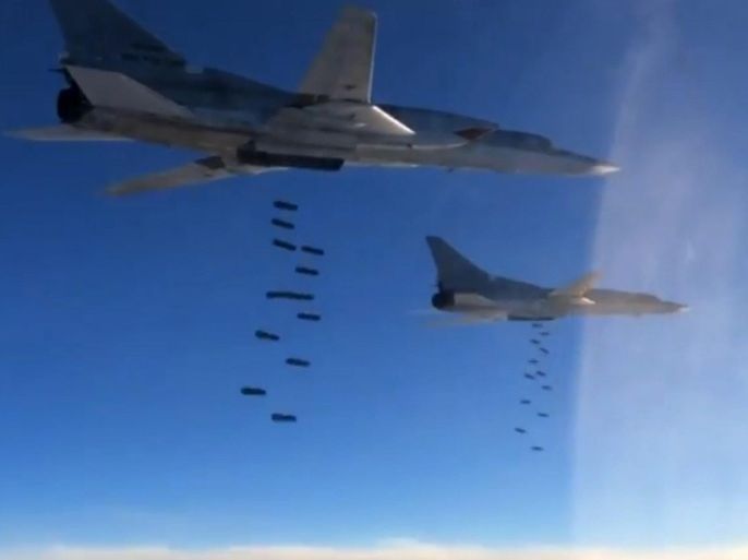 A handout frame grab from video footage published on the official website of the Russian Defence Ministry 18 November 2015 shows Russian TU-22M3 long-range strategic bombers dropping OFAB-250-270 bombs at targets in Syria. Russian aviation has significantly increased the intensity of strikes against what Russia says were Islamic State targets in Syria. EPA/RUSSIAN DEFENCE MINISTRY PRESS SERVICE BEST QUALITY AVAILABLE/HANDOUT EDITORIAL USE ONLY/NO SALES