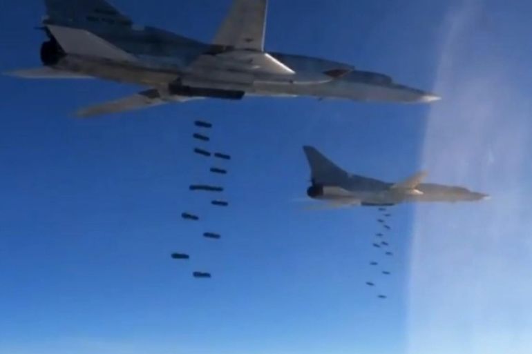 A handout frame grab from video footage published on the official website of the Russian Defence Ministry 18 November 2015 shows Russian TU-22M3 long-range strategic bombers dropping OFAB-250-270 bombs at targets in Syria. Russian aviation has significantly increased the intensity of strikes against what Russia says were Islamic State targets in Syria. EPA/RUSSIAN DEFENCE MINISTRY PRESS SERVICE BEST QUALITY AVAILABLE/HANDOUT EDITORIAL USE ONLY/NO SALES