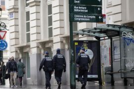 Belgian policee patrol near the Sablon shopping street in Brussels on Saturday, Nov. 21, 2015. Belgium raised its security level to the highest degree on Saturday as the manhunt continues for extremist Salah Abdeslam who took part in the Paris attacks. (AP Photo/Virginia Mayo)