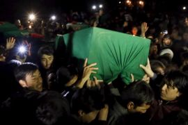 Men carry one of the coffins for the seven people who were killed by unknown militants, during a protest procession in Kabul, Afghanistan November 10, 2015. A protest convoy drove the bodies of seven members of Afghanistan's minority Hazara community to the capital Kabul on Tuesday to protest against their murder by unknown militants, who dumped their partially beheaded bodies at the weekend. REUTERS/Mohammad Ismail