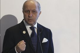 France's Foreign Minister Laurent Fabius gestures as he talks during a news conference at the end of the G-20 summit in Antalya, Turkey, Monday, Nov. 16, 2015. The leaders of the Group of 20 wrapped up their two-day summit near the Turkish Mediterranean coastal city of Antalya Monday against the backdrop of heavy French bombardment of the Islamic State's stronghold in Syria. The bombings marked a significant escalation of France's role in the fight against the extremist group. (Anadolu Agency via AP, Pool)