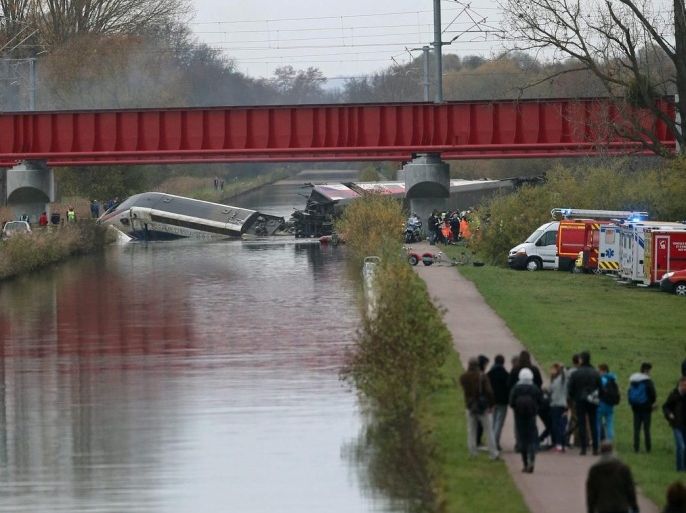 General view of a crash of a TGV train that fell from a bridge in Eckwersheim, near to Strasbourg, France, 14 November 2015. Five people were reported dead and about 60 injured. The train derailed while on a bridge and the cars fell into the Marne-Rhine canal, to reports. There have been no terror-related reports and no links to the attacks of the previous night in Paris. EPA/JEAN MARC LOOS FRANCE OUT / CORBIS OUT