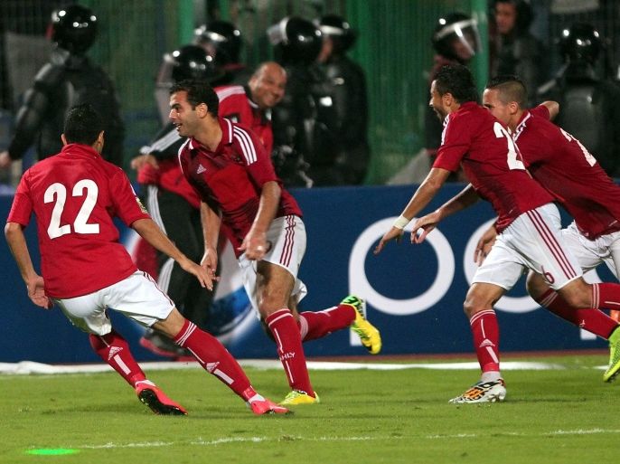 Al-Ahly player Emad Meteb (2L) celebrates with his teammates after scoring the winning goal during the CAF Confederation Cup final second leg soccer match between Al Ahly and Sewe Sport in Cairo, Egypt, 06 December 2014.
