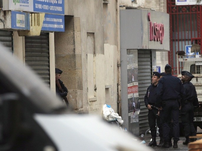 Police forces stand outside a house in Saint-Denis, France, Thursday, Nov. 19, 2015 where yesterdays suspects were arrested after last Friday's attacks. The Belgian jihadi suspected of masterminding deadly attacks in Paris was killed in a police raid on a suburban apartment building, the city prosecutor's office announced Thursday. With France still reeling from the Friday attacks that killed 129 people and wounded hundreds of others, Prime Minister Manuel Valls warned that Islamic extremists might at some point use chemical or biological weapons, and urged lawmakers to extend a national state of emergency by three months. (AP Photo/Christophe Ena)