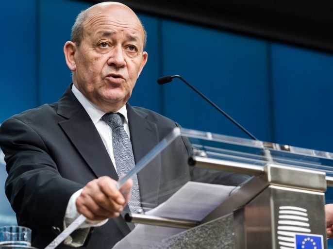 France's Defense Minister Jean-Yves Le Drian addresses the media during an EU foreign and defense ministers meeting at the EU Council building in Brussels on Tuesday, Nov. 17, 2015. France has demanded that its European partners provide support for its operations against the Islamic State group in Syria and Iraq and other security missions in the wake of the Paris attacks. (AP Photo/Geert Vanden Wijngaert)