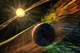 This image made available by NASA on Thursday, Nov. 5, 2015 shows an artist's rendering of a solar storm hitting the planet Mars and stripping ions from the planet's upper atmosphere. NASA's Mars-orbiting Maven spacecraft has discovered that the sun robbed the red planet of its once-thick atmosphere and water. On Thursday, scientists reported that even today, the solar wind is stripping away about 100 grams of atmospheric gas every second. (Goddard Space Flight Center/NASA via AP)