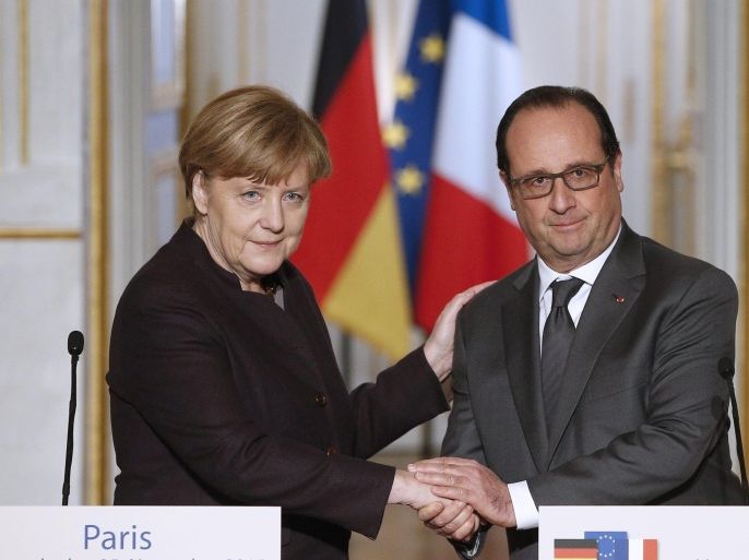 German Chancellor Angela Merkel (L) and French President Francois Hollande (R) shake hands after making a statement at the Elysee Palace in Paris, France, 25 November 2015. French President Francois Hollande and German Chancellor Angela Merkel meet to discuss the response to the November 13 terrorist attacks in Paris.
