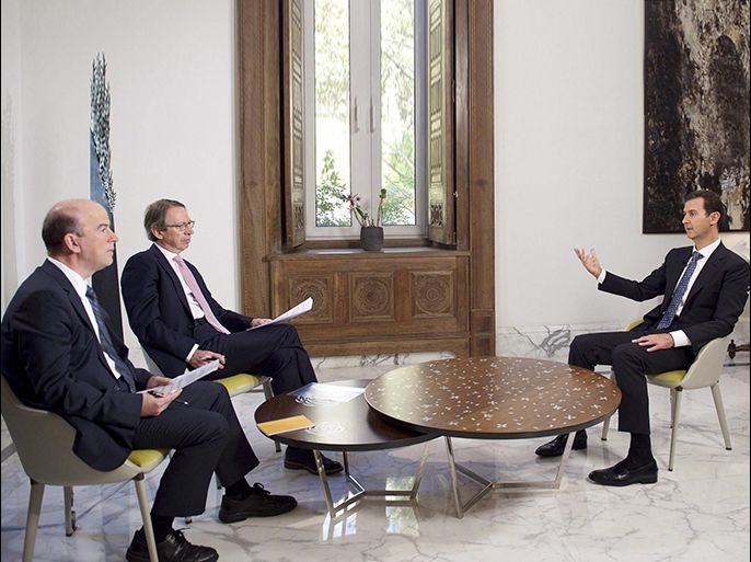 A handout picture made available by the Syrian Presidency on 11 December 2015, shows Syrian President, Bashar Al-Assad (R), with the President of the Spanish news agency EFE, Jose Antonio Vera (C), and EFE's International Director, Jose Manuel Sanz (L), during an exclusive interview with Spanish news agency EFE, on 10 December 2015. EPA/SYRIAN PRESIDENCY / HANDOUT HANDOUT EDITORIAL USE ONLY/NO SALES