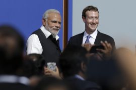 Prime Minister of India Narendra Modi, left, poses for photos with Facebook CEO Mark Zuckerberg after speaking at Facebook in Menlo Park, Calif., Sunday, Sept. 27, 2015. A rare visit by Indian Prime Minister Narendra Modi this weekend has captivated his extensive fan club in the area and commanded the attention of major U.S. technology companies eager to extend their reach into a promising overseas market. (AP Photo/Jeff Chiu)