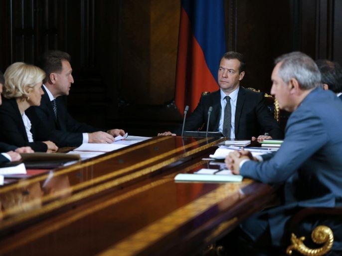 Russian Prime Minister Dmitry Medvedev, second right, meets with his deputies in the Gorki residence outside in Moscow, Russia, Monday, Nov. 30, 2015. Russia will restrict imports of Turkish fruit and vegetables as part of a package of new sanctions following the downing of a Russian warplane by Turkey last week. (Dmitry Astakhov/Sputnik, Government Pool Photo via AP)