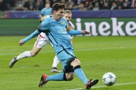 Barcelona's Lionel Messi scores the opening goal during the Champions League Group E soccer match between Bayer Leverkusen and FC Barcelona in Leverkusen, western Germany, Wednesday, Dec. 9, 2015. (AP Photo/Martin Meissner)